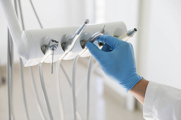 Professional Tooth Extraction technician working in St. Ignace, MI